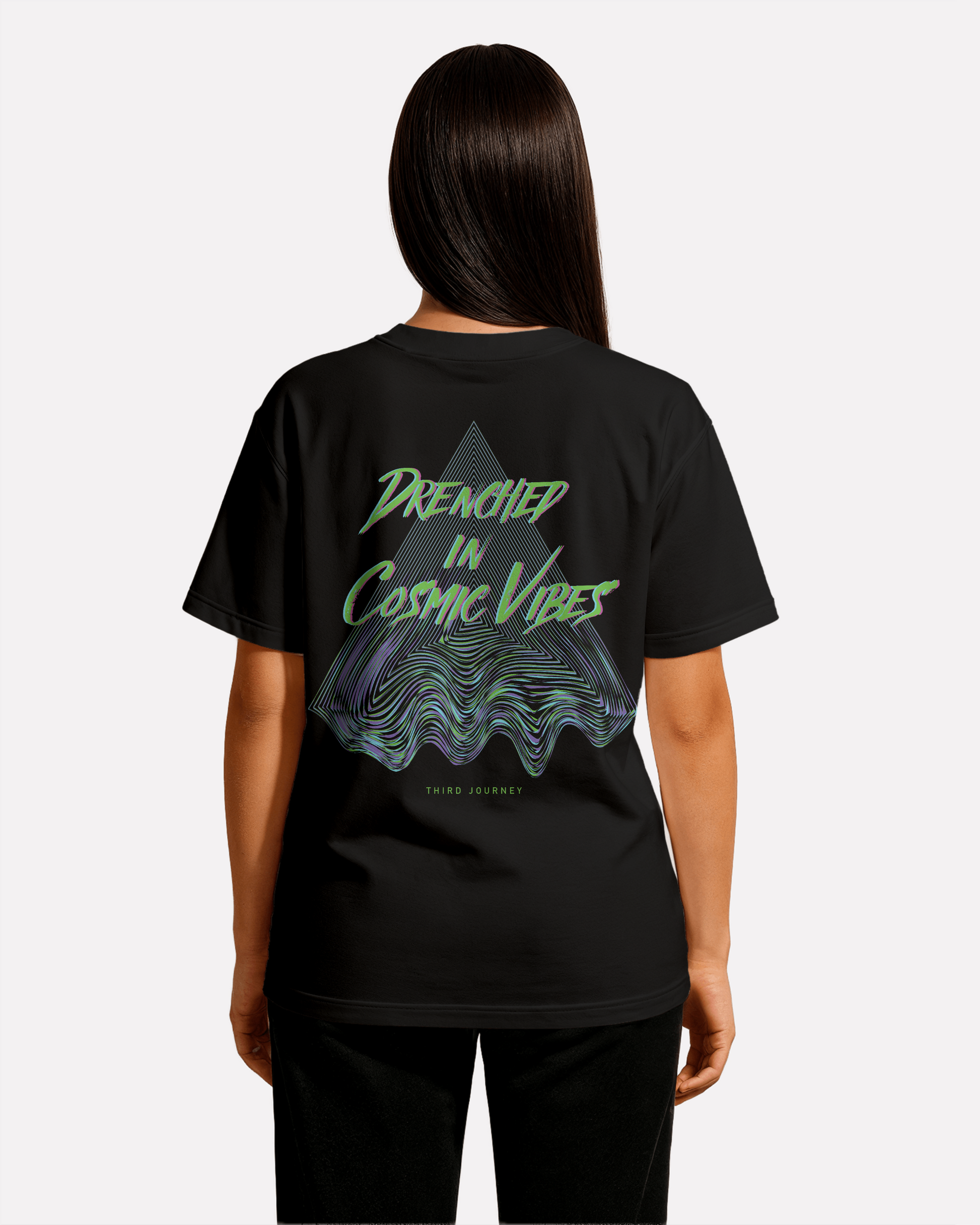 female model wearing Third Journey black t-shirt featuring psychedelic triangle graphic and “Drenched in Cosmic Vibes” text in neon green and purple tones