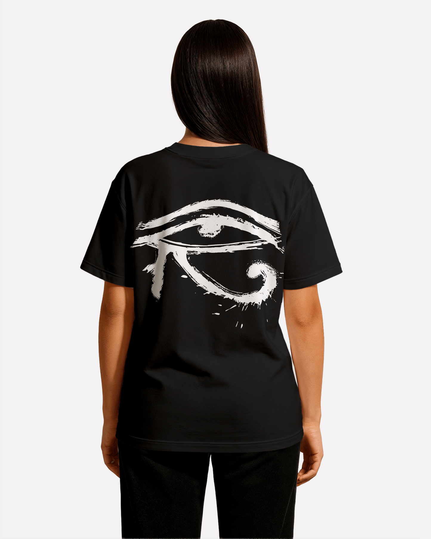 model wearing Third Journey black t-shirt displaying a white Eye of Horus graphic on the back with spiritual symbolism