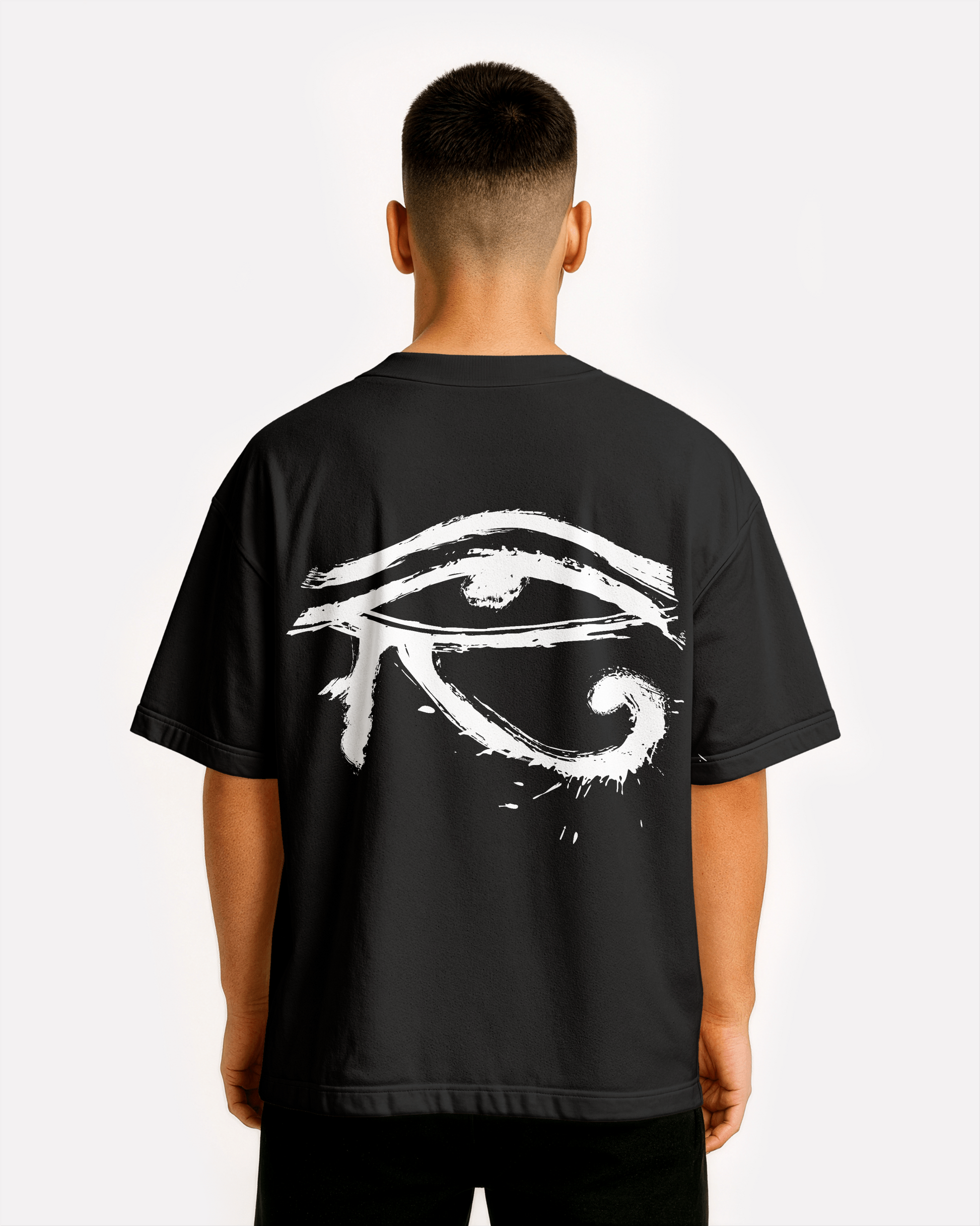 model wearing Third Journey black t-shirt displaying a white Eye of Horus graphic on the back with spiritual symbolism