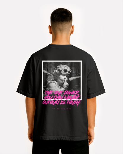 Back view of model wearing black Third Journey oversized t-shirt featuring glitch-style cherub artwork and neon pink text reading “The one power you can never outrun is truth”